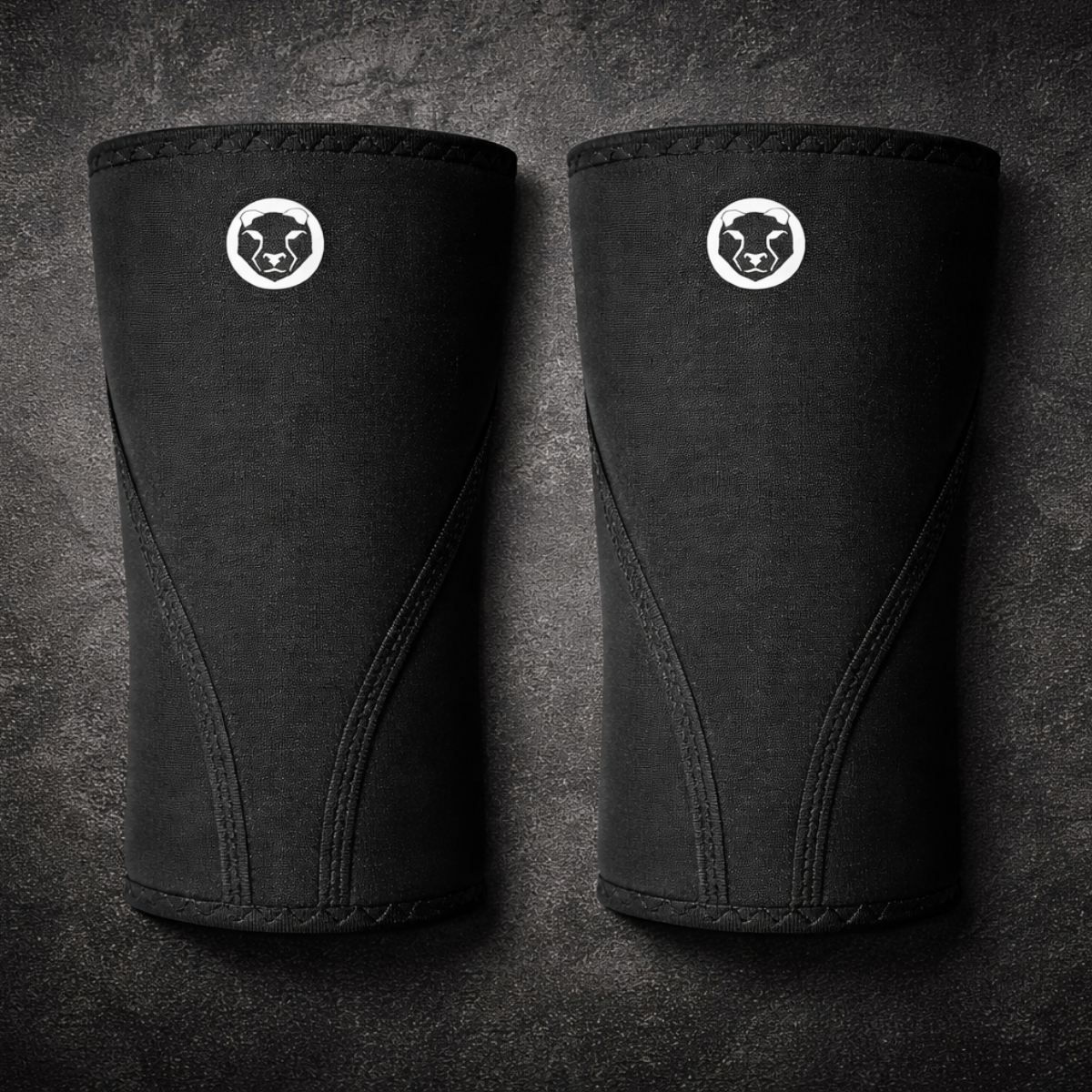 Front view of a pair of Mammal Strength Stiff Knee Sleeves PRO featuring ultra-stiff black CR neoprene and Mammal Strength logo

